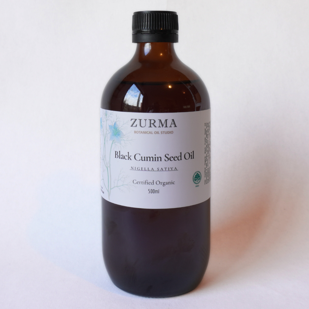 Bottle of Zurma Black Cumin Seed Oil on a white background